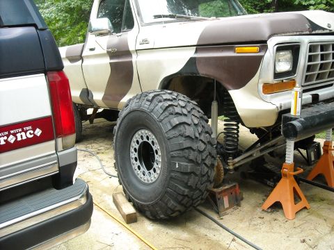 1979 Ford F-150 - This 1979 Ford F-150 pickup truck features a camouflage paint scheme and is equipped with large off-road tires.