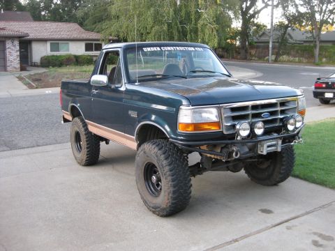 1995 Ford Bronco - This modified Ford Bronco features an "Under Construction 4x4" decal on the windshield and a custom front bumper with auxiliary lights and…