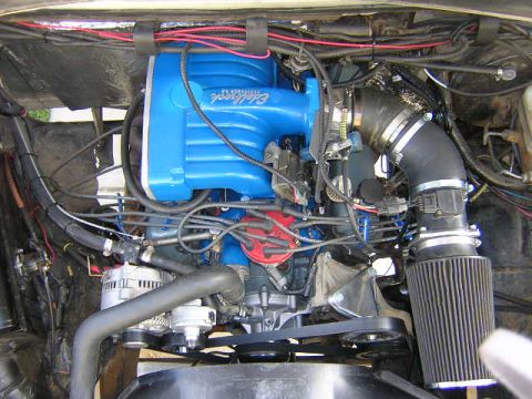 1993 Ford F-150 - Engine bay detail with aftermarket intake manifold and air filter.