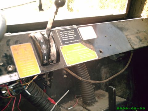 1978 Ford Bronco - Interior view of a vehicle dashboard showing controls and warning labels.