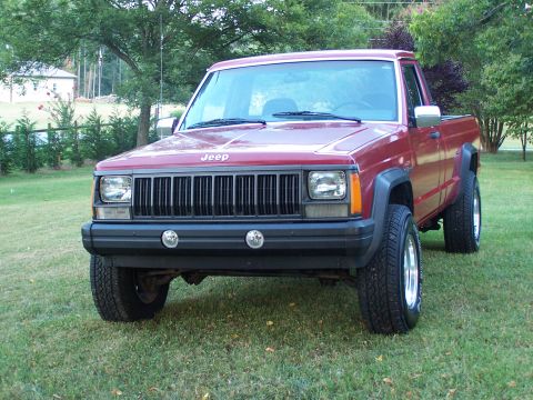 1991 Jeep Comanche - This 1991 Jeep Comanche pickup truck is shown from the front in a grassy yard.