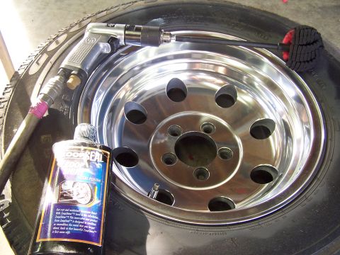 1991 Jeep Comanche - Polishing a chrome wheel with an air tool and metal polish.