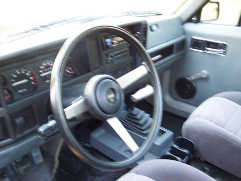 1991 Jeep Comanche - Interior view of a 1991 Jeep Comanche, highlighting the dashboard and driver's area.