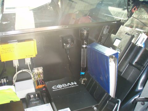 2006 Dodge Charger - Interior view of a police vehicle showing various electronic equipment and accessories.