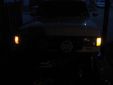 1990 Ford F-150 - Front view of a 1990 Ford F-150 pickup truck at night, showing headlights and turn signals.
