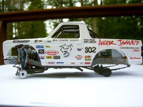 1986 Ford Bronco - Model of a 1986 Ford Bronco race truck, complete with sponsor decals and visible engine parts.
