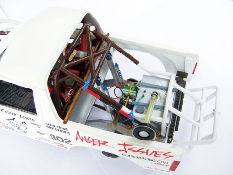 1986 Ford Bronco - Detailed model of a truck's interior, showing a complex roll cage and racing modifications.