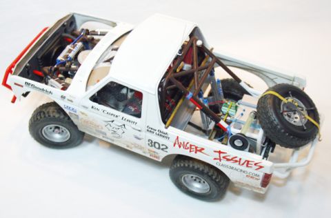 1986 Ford Bronco - Model of a modified off-road truck with 'Anger Issues' and racing numbers visible on the body.