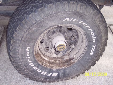 1986 Ford Bronco - Close-up of a BFGoodrich All-Terrain T/A tire and wheel assembly.