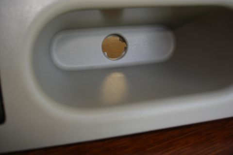 2006 Ford Fusion - Close-up view of an interior door handle recess, showing a circular opening.