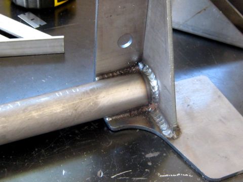 1996 Ford Bronco - A close-up view of a metal bracket, showing its construction and welding details.