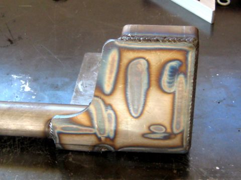 1996 Ford Bronco - Close-up of a welded metal part showing heat discoloration from the welding process.
