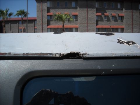 1990 Ford C-150 (Centurion Conversions) - The vehicle's roof shows extensive rust and damage, indicating poor condition.