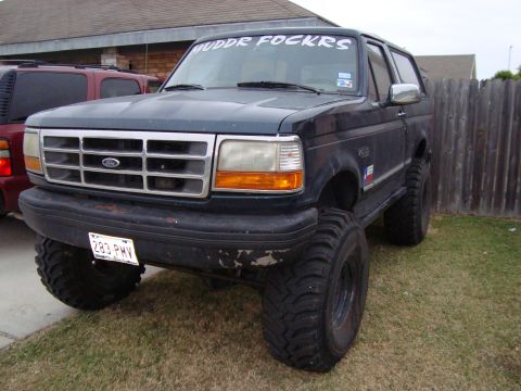 1995 Ford Bronco - This 1995 Ford Bronco features a lifted suspension and oversized tires, giving it a stance.