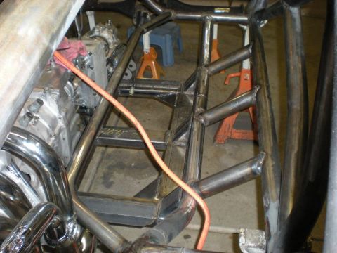 Suzuki Samurai - Custom tube chassis frame with engine and exhaust headers visible.