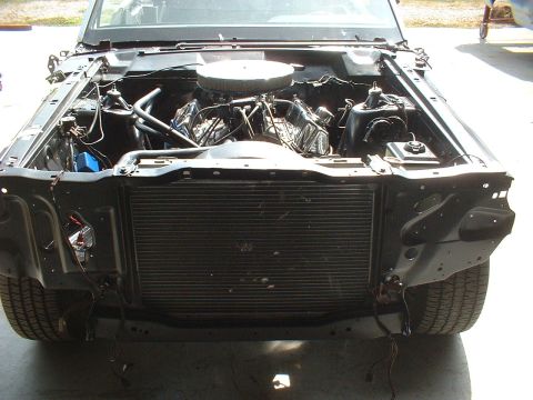 1970 Ford Torino - The engine bay of a 1970 Ford Torino shows its V8 engine and radiator, ready for restoration.