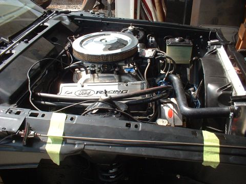 1970 Ford Torino - Close-up view of a vehicle's engine bay, Ford Racing valve covers and a prominent chrome air cleaner assembly.