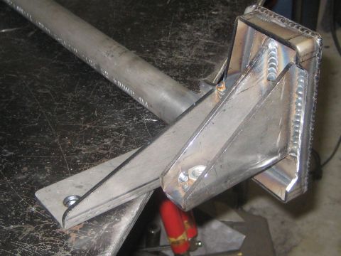 1996 Ford Bronco - A custom-fabricated metal bracket is shown, visible welds and mounting holes.
