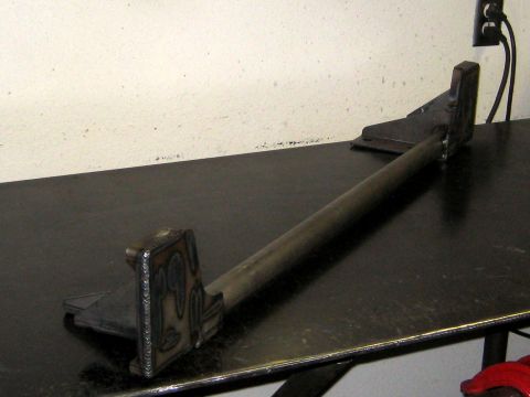 1996 Ford Bronco - Custom fabricated front bumper part shown on a workbench.