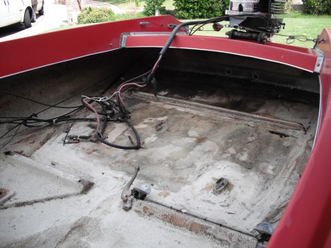 1991 Ford Bronco - Boat interior with exposed wiring and a dirty floor, likely needing restoration.