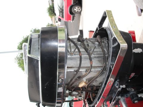 1991 Ford Bronco - Close-up view of a boat motor's engine components, including spark plug wires and chrome detailing.