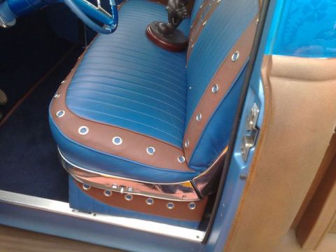 1991 Ford LTD Crown Victoria - The interior features blue vinyl seats with brown leather accents and chrome trim, suggesting a custom or vintage build.