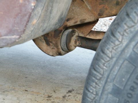1982 Ford Bronco - A close-up view of a vehicle's suspension system and tire, with visible text from Supermotors.net.