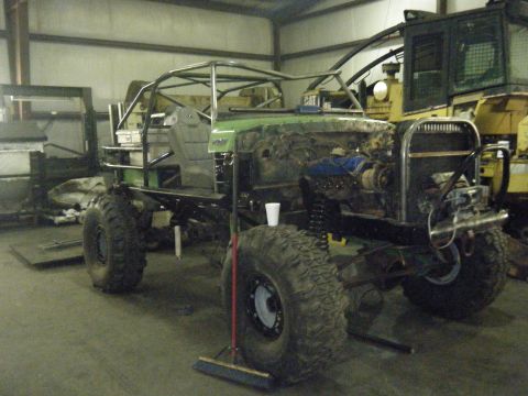 1978 Ford Bronco - This heavily modified vehicle is undergoing extensive customization in a workshop environment.