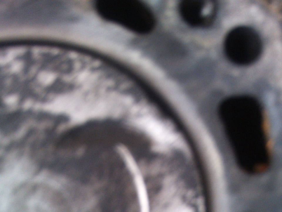 Close-up of engine part with Supermotors logo