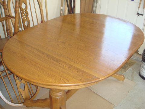 1988 Ford F-150 - A wooden dining table and chairs are visible in what appears to be a garage or workshop area.