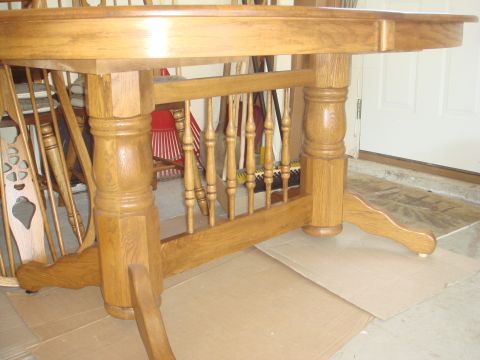 1988 Ford F-150 - Wooden dining table legs and spindles are shown in this close-up view. The Supermotors.net logo is visible at the bottom right.