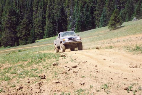1996 Ford Bronco - Brandon McNally on the hill climb to Funny Rocks/Moon Rocks. (7/14/2002)