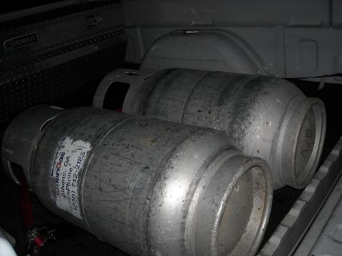 1979 Ford F-150 - Two propane tanks are in the bed of a truck next to a toolbox.