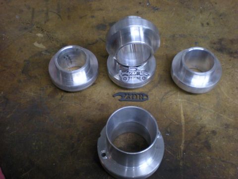 Suzuki Samurai - Several machined aluminum parts are laid out on a textured surface, with a ZDR logo visible.