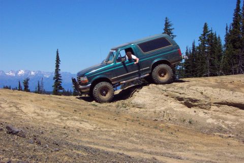1996 Ford Bronco - Greg Myers checking out breakover angle at Moon Rocks. (7/14/2002)