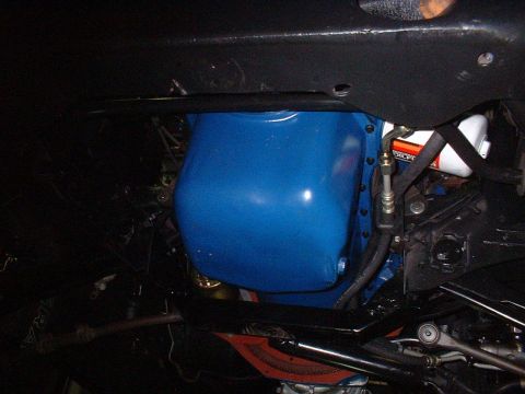 1970 Ford Torino - Close-up view of a blue oil pan and oil filter, likely from an engine bay.