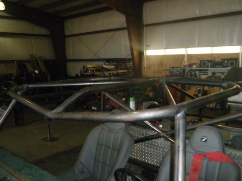 1978 Ford Bronco - Custom roll cage installed in a vehicle, bucket seats and diamond plate accents.