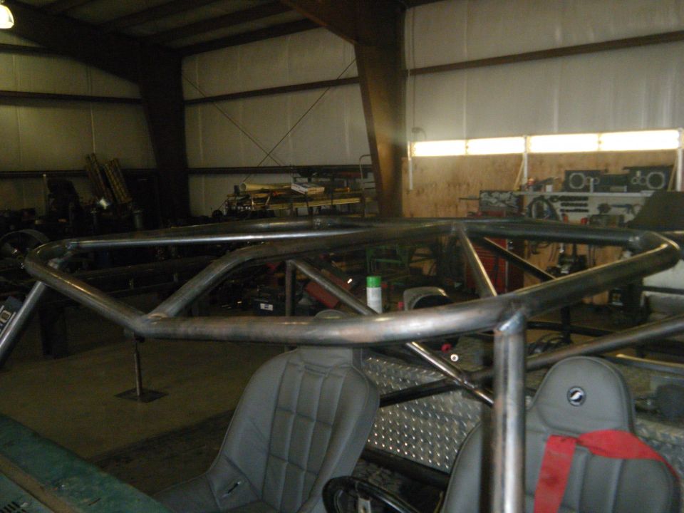 Roll cage inside a vehicle with bucket seats