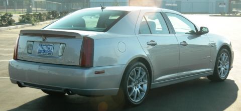 2006 Cadillac STS - The rear view of a silver 2006 Cadillac STS sedan shows its taillights, spoiler, and license plate.
