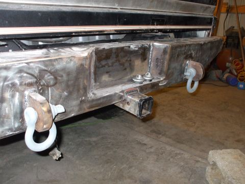 1995 Ford Bronco - Custom rear bumper with tow hitch and D-rings, likely for an off-road vehicle.