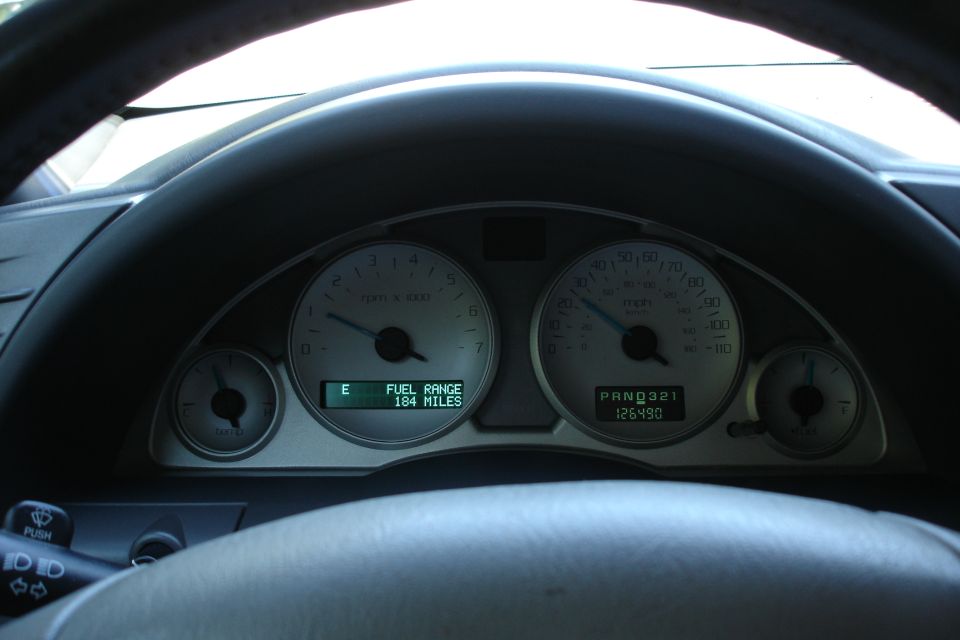 Instrument cluster showing tachometer, speedometer and 126490 mile odometer