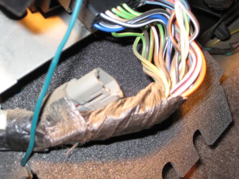 1995 Ford Bronco - Vehicle wiring harness detail with many wires and a connector visible.