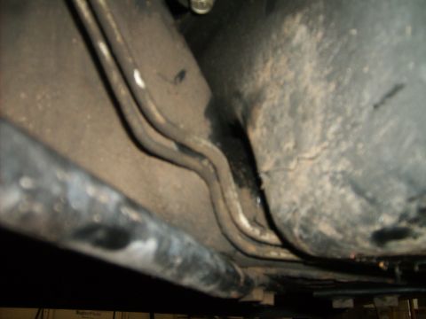 1993 Ford Crown Victoria - Underside view of vehicle fuel lines and associated components.