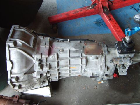 1993 Ford Crown Victoria - This is a close-up view of an automatic transmission, likely removed from a vehicle for repair or replacement.