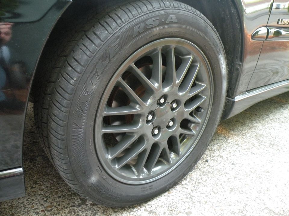 Close-up of a car's front wheel and tire. The tire is a Goodyear Eagle RSA. The wheel is a multi-spoke alloy