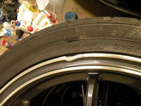 1998 Subaru Legacy - Tire and rim detail, showing tire size and a warning about rim size. The rim appears damaged.