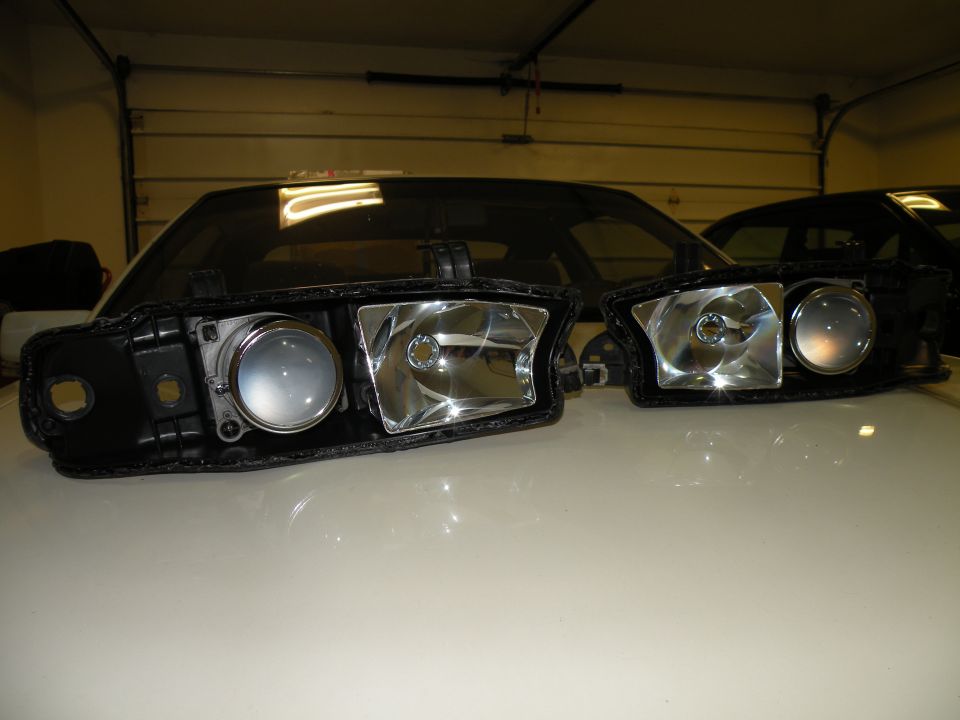 Pair of car headlights, possibly for a Subaru Legacy