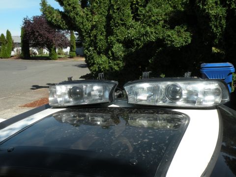 1998 Subaru Legacy - A pair of car headlights are displayed on the roof of a vehicle.