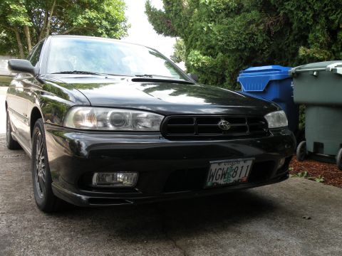 1998 Subaru Legacy - Front view of a black 1998 Subaru Legacy sedan with Oregon license plate WGW 811.