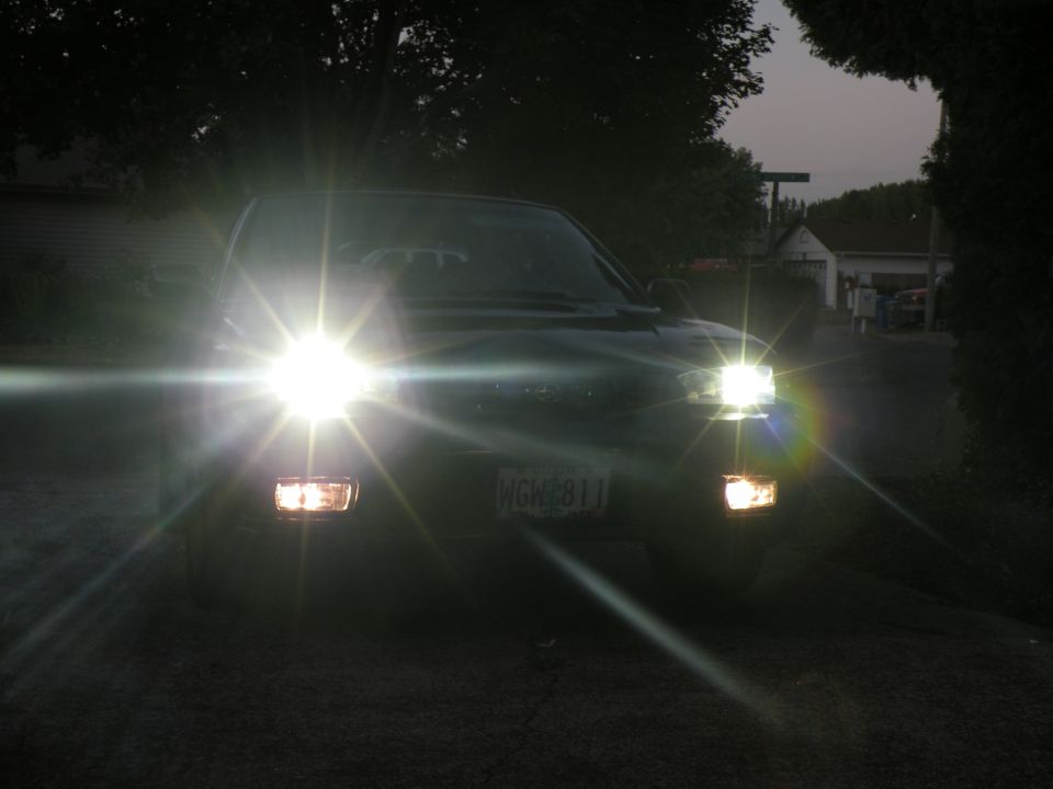 Car's headlights are on, license plate WGH 811